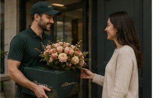 An enflowers courier delivering flowers to a doorstep