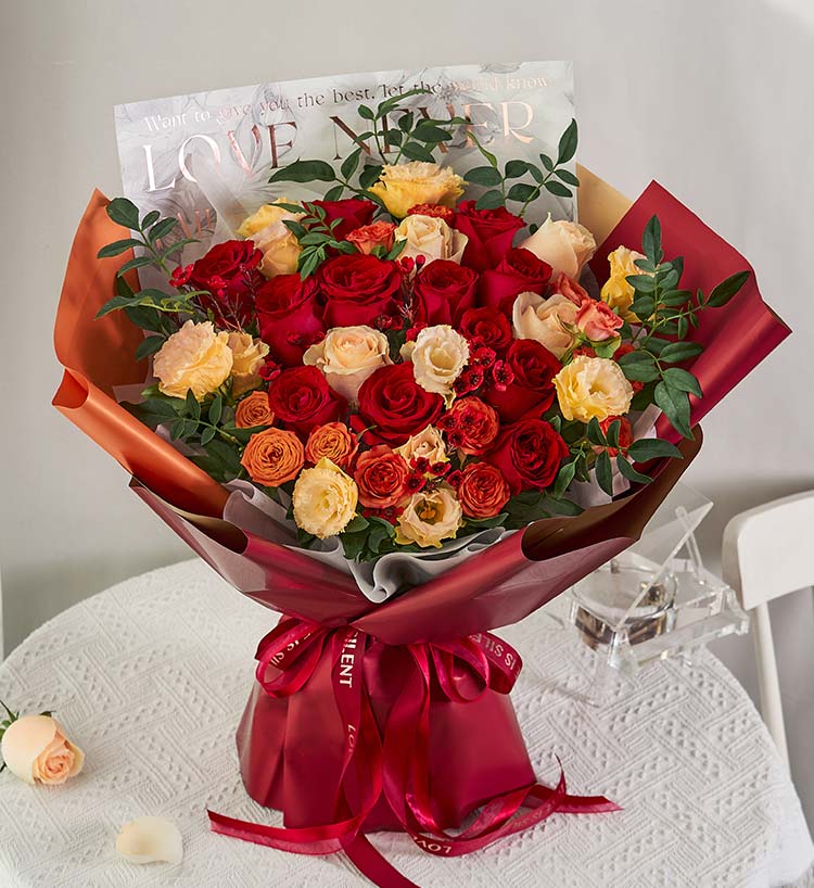 Twelve Champagne Roses & Nine-star Leaves Bouquet